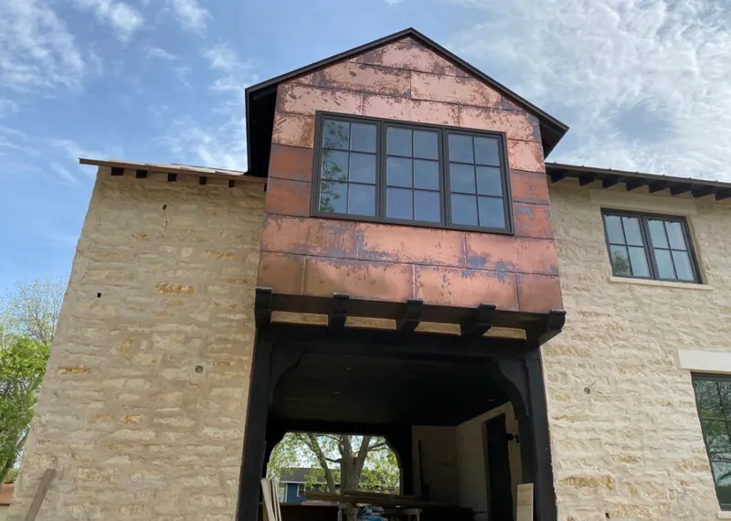 Copper metal panel facade on a stone building for Skylight Installation in Oklahoma City