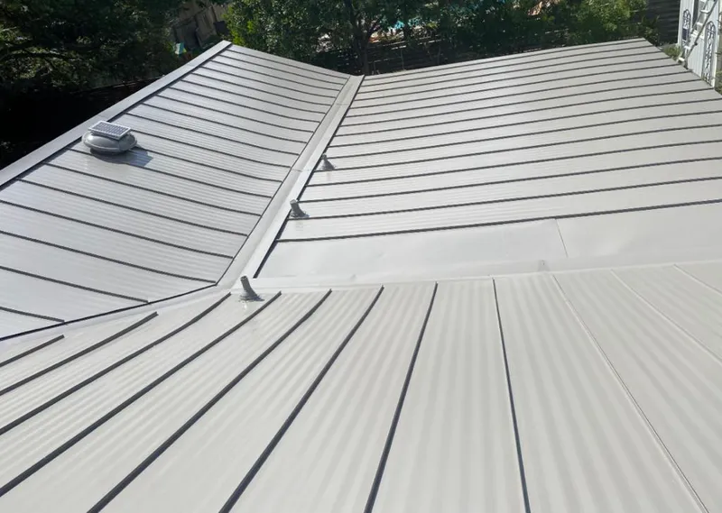 Solar attic fan installed on a metal roof for Roof Ventilation in Oklahoma City